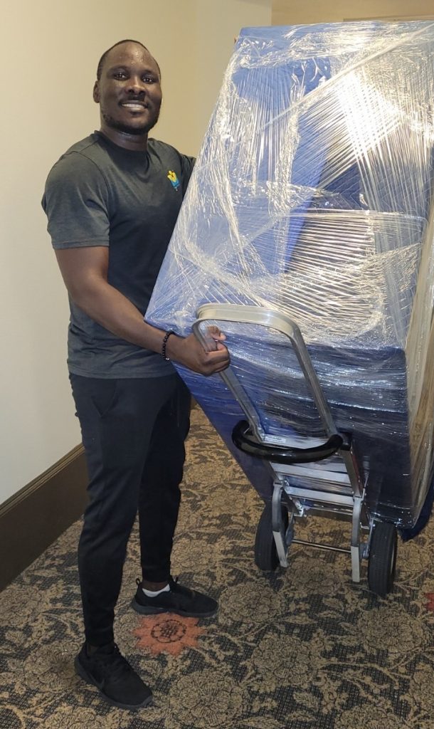 DID Movers crew member handling residential furniture in Houston